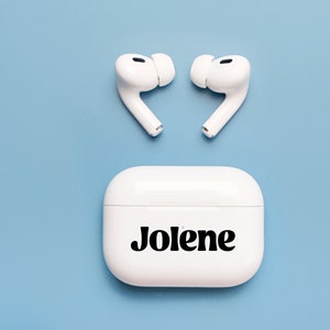 May include: White wireless earbuds in a white charging case with the name "Jolene" printed in black bold letters.