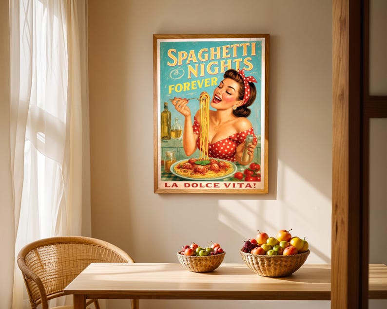 May include: A framed vintage-style poster with the text "Spaghetti Nights Forever" and "La Dolce Vita!" features a woman eating spaghetti. The poster is in a wooden frame and hangs on a beige wall. A wooden table with fruit baskets and a wicker chair are in front of the poster.