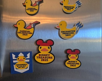 May include: A collection of yellow rubber duck magnets with different designs. The ducks have red, white, and blue accents and feature text such as "Carnival Celebration 2025", "Enchanted Princess 2025", and "Disney Treasure 2025".