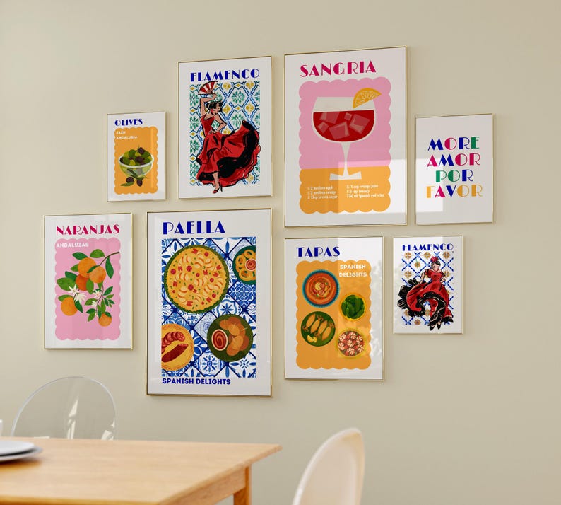 May include: A set of eight colorful prints with Spanish-themed illustrations and text. The prints feature images of oranges, olives, sangria, paella, tapas, and flamenco dancers. The text includes the words "Naranjas", "Paella", "Tapas", "Flamenco", "Sangria", "Olives", "More Amor Por Favor", and "Spanish Delights".