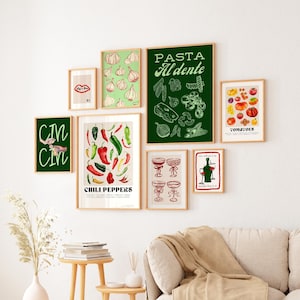 May include: A gallery wall of framed prints with a green and white color scheme. The prints feature illustrations of various food items, including chili peppers, tomatoes, garlic, and pasta. The text "PASTA AL DENTE" is featured on one of the prints.