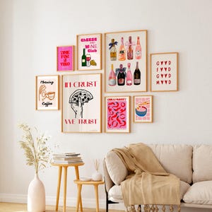 May include: A collection of eight framed prints with various designs, including a pizza, wine bottles, coffee, and a bowl of noodles. The prints are all in a pink and red color scheme and have a modern, minimalist aesthetic.
