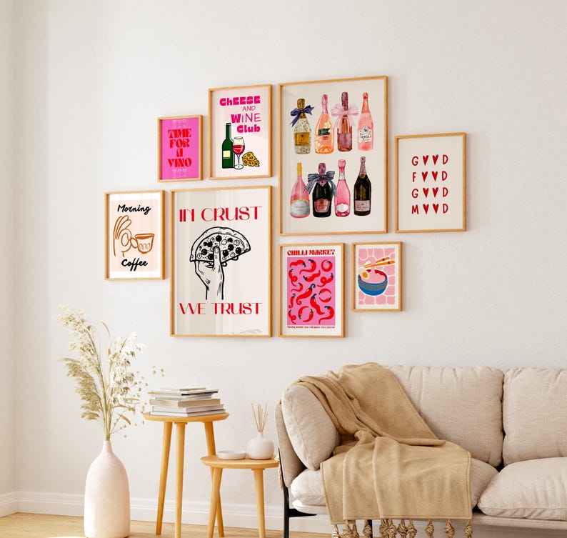 May include: A collection of eight framed prints with various designs, including a pizza, wine bottles, coffee, and a bowl of noodles. The prints are all in a pink and red color scheme and have a modern, minimalist aesthetic.