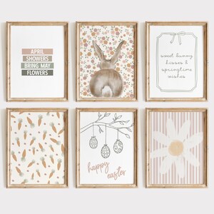 Pu&ograve; includere: Set di sei stampe artistiche incorniciate a tema pasquale. Le stampe presentano un coniglietto, carote, una margherita e il testo che recita "April Showers Bring May Flowers", "sweet bunny kisses & springtime wishes", e "happy easter".