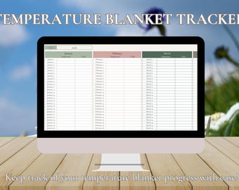 Könnte beinhalten: Ein Computermonitor zeigt eine digitale Temperature Blanket Tracker Tabelle. Der Bildschirm enthält Spalten für Januar, Februar und März mit Zeilen für tägliche Temperatur- und Farbeingaben. Der Text Temperature Blanket Tracker ist zu sehen.