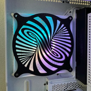 May include: A black computer fan with a swirling, abstract design. The fan is illuminated with a blue and purple gradient.