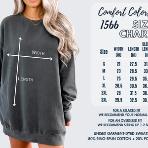 May include: A size chart for a unisex garment-dyed sweatshirt made of 80% ring-spun cotton and 20% polyester. The chart shows the width, length, and sleeve length in inches for sizes S through 3XL.