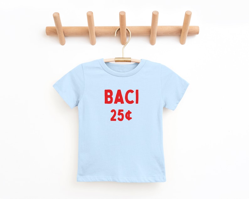 May include: A light blue t-shirt with the words "BACI 25&cent;" printed in red.