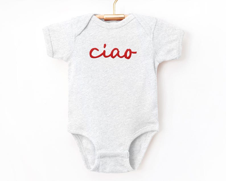 May include: A gray short-sleeved bodysuit with the word "ciao" in red lettering.