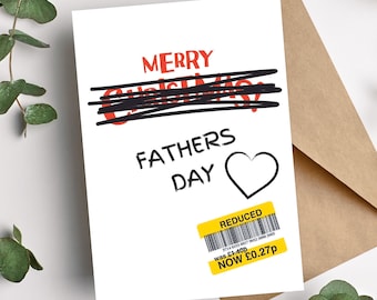 May include: A white card with red text that says "Merry Christmas" with a black line drawn through it. The text "Fathers Day" is written below with a red heart next to it. A yellow sticker with black barcode and red text says "Reduced" and "was £1.40p NOW £0.27p".