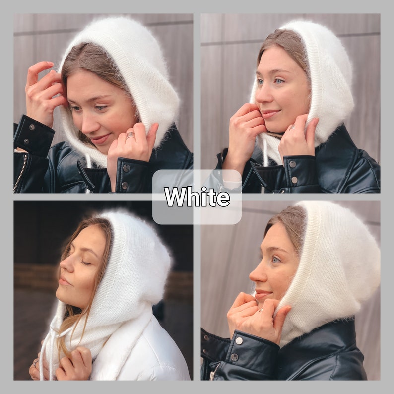 May include: White hooded hat made of soft, fuzzy yarn. The hat is shown being worn by a person with a black leather jacket.