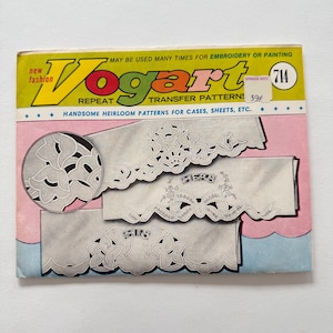 May include: Vintage Vogart transfer patterns packet with floral designs. The packet has a yellow, green, and pink color scheme. The text reads "Handsome Heirloom Patterns for Cases, Sheets, Etc."
