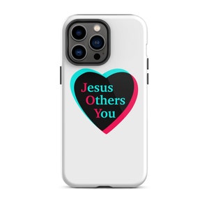 May include: White phone case with a black heart design. The heart has a blue and pink outline and the text "Jesus Others You" inside.