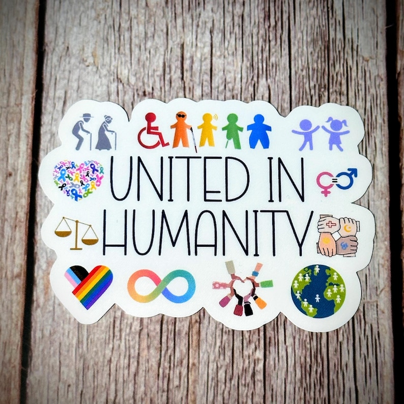 May include: A white sticker with the words "UNITED IN HUMANITY" in black. The sticker features various colorful icons representing diversity, including people with disabilities, LGBTQ+ symbols, and a globe.