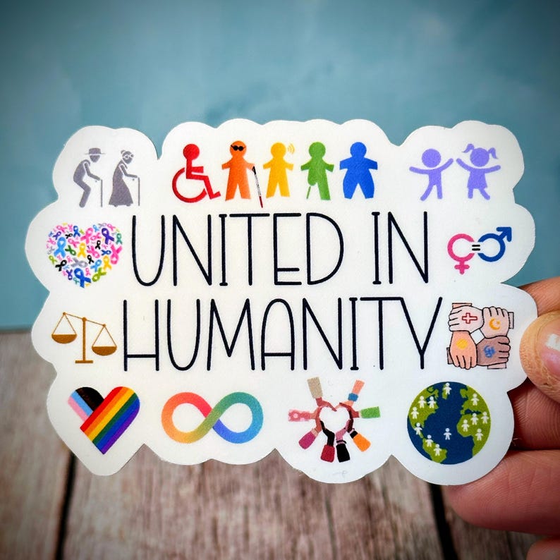 May include: A white sticker with the words "UNITED IN HUMANITY" in black, featuring colorful icons of diversity and inclusion. The sticker includes images of people with disabilities, LGBTQ+ symbols, and a globe.
