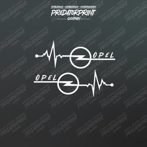 Puede incluir: Dos calcomanías de vinilo blanco con un latido del corazón estilizado y el logotipo de Opel. Las calcomanías están sobre un fondo gris oscuro. El texto "PREDATORPRINT GENTHIN" se repite en el fondo.