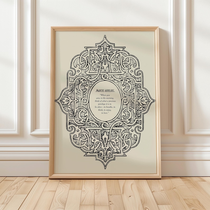 May include: Black and white printable art print with an ornate design and a quote by Marcus Aurelius: "When you arise in the morning, think of what a precious privilege it is to be alive - to breathe, to think, to enjoy, to love."