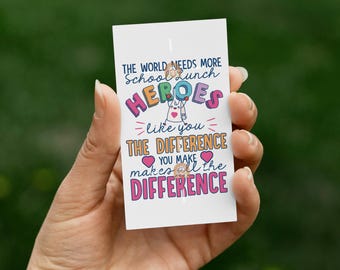 May include: A colorful card with the text "The world needs more school lunch heroes like you. The difference you make makes all the difference."  The card features a cartoon illustration of a person wearing a superhero cape and holding a lunchbox.