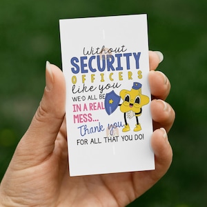 May include: A white card held in a hand with text that reads "Without SECURITY OFFICERS like you WE'D ALL BE IN A REAL MESS... Thank you FOR ALL THAT YOU DO!" A cartoon star character is holding a shield.