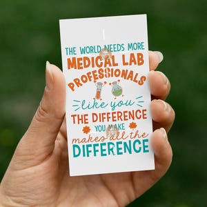 May include: A white card with blue and orange text that reads "The world needs more medical lab professionals like you. The difference you make makes all the difference."