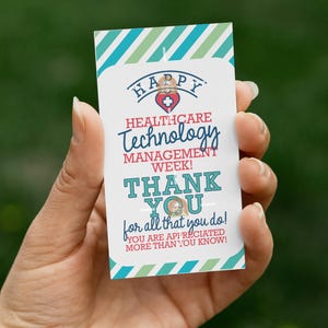 May include: A white card with text that reads "HAPPY HEALTHCARE TECHNOLOGY MANAGEMENT WEEK! THANK YOU for all that you do! YOU ARE APPRECIATED MORE THAN YOU KNOW!" The card has a green and blue striped border.