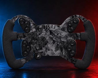 May include: A racing steering wheel featuring a forged carbon fiber finish on the central plate and black textured grips on both sides. The device includes four clusters of three black buttons and a single circular button with a white logo.