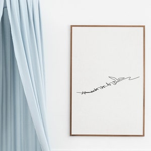 May include: A framed art print featuring a minimalist line drawing of a bird in flight. The artwork is rendered in black against a white background, with a brown frame. The image includes the text "be free" in a stylized font.