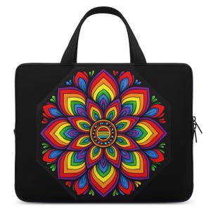 May include: Black laptop bag featuring a vibrant, rainbow-colored floral design. The flower has a central circle with a striped pattern and is surrounded by petals in shades of red, orange, yellow, green, blue, and purple. The bag has a black handle and zipper.