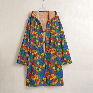 May include: A long, hooded coat with a colorful stained-glass pattern in shades of red, orange, yellow, green, blue, and purple. The coat has a brown toggle closure and a tan, fuzzy interior lining.