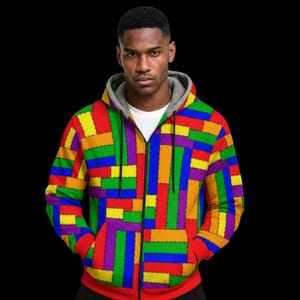 Sudadera con capucha de retazos coloridos para hombre: tejido scuba con estampado geométrico, forro de felpa gris.