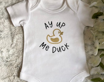 Ay Up Me Duck Baby Grow: Golden Duck Motif with optional bib - FREE Delivery