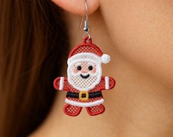 May include: A single Christmas-themed earring featuring a Santa Claus design. The earring is red and white with a black belt and a smiling face. The earring is made of a lace-like material and hangs from a silver hook.