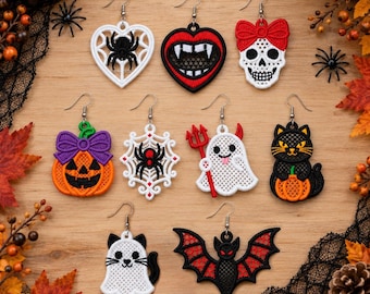 May include: A collection of ten Halloween-themed embroidered earrings featuring various designs including a spider in a heart, vampire lips, a skull with a red bow, a pumpkin, a spider web, a ghost with a trident, a black cat, and a bat.