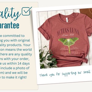May include: A maroon t-shirt with a graphic of a Luna Moth and the text "Actias Luna Luna Moth" printed on the front. The shirt is displayed on a wooden surface with a green plant in the background. The text "Thank you for supporting our small business!" is written in blue ink on the bottom of the image.