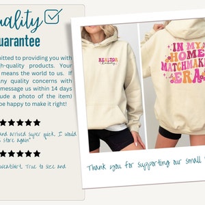 May include: Two cream-colored hoodies with different designs. The first hoodie has the word "REALTOR" with a name on the left side. The second hoodie has the text "IN MY HOME MATCHMAKER ERA" with pink and orange lettering and floral designs. Both hoodies have a drawstring hood.