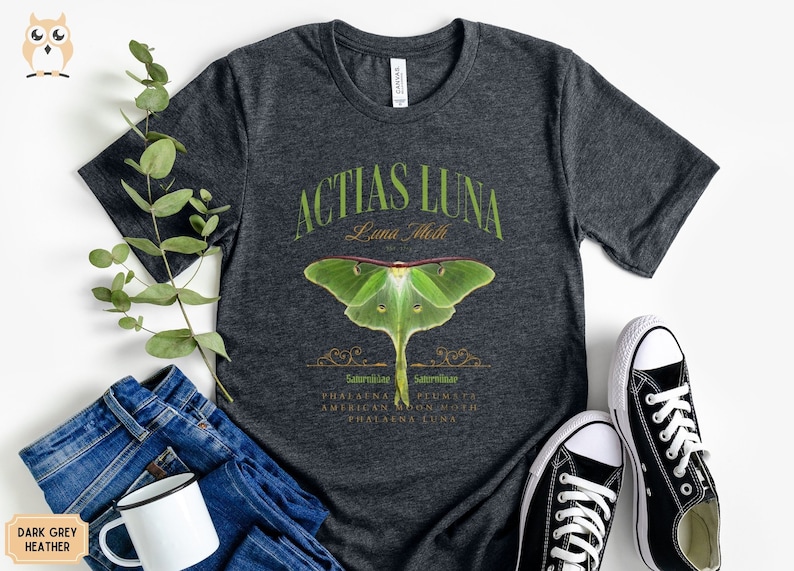 May include: Dark grey heather t-shirt with a green luna moth illustration and the text "Actias Luna Luna Moth" in a vintage style font.