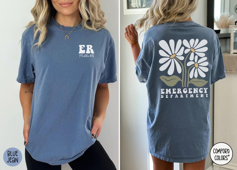 May include: A blue t-shirt with a white daisy design and the text "Emergency Department" on the back. The front of the shirt has the text "ER" and "Maddie RN".