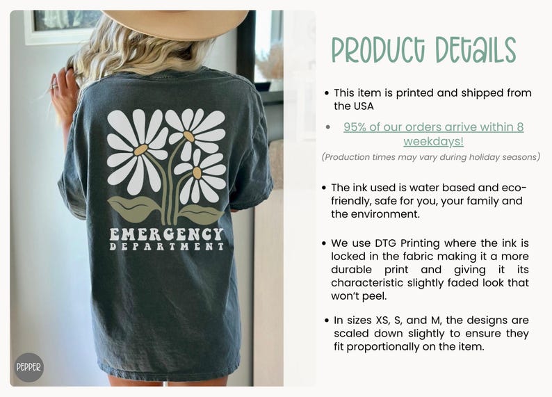 May include: A dark gray t-shirt with a graphic of three white daisies and green leaves. The text "EMERGENCY DEPARTMENT" is printed in white below the daisies.