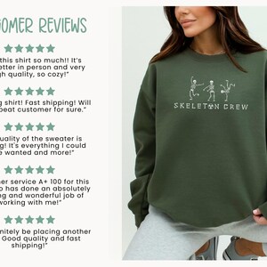 May include: A green sweatshirt with the text "SKELETON CREW" and a graphic of three skeletons dancing. Customer reviews are shown on the left side of the image.