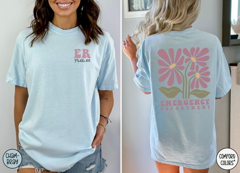 May include: Light blue t-shirt with the text "ER" and "Med Tech RN" on the front. The back of the shirt has a pink floral design with the text "Emergency Department".
