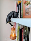 Black cat shelf ornament holding hanging flickering lantern, book lover gift, cosy home decor, cat lover gift, handmade product logo