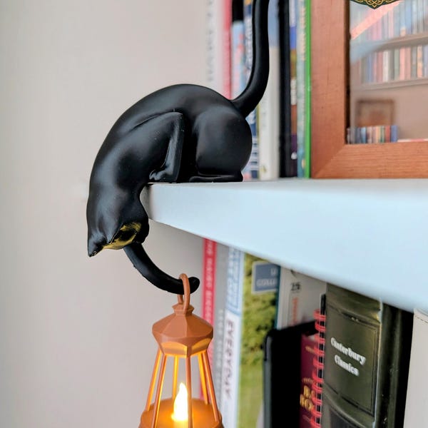 Black cat shelf ornament holding hanging flickering lantern, book lover gift, cosy home decor, cat lover gift, handmade