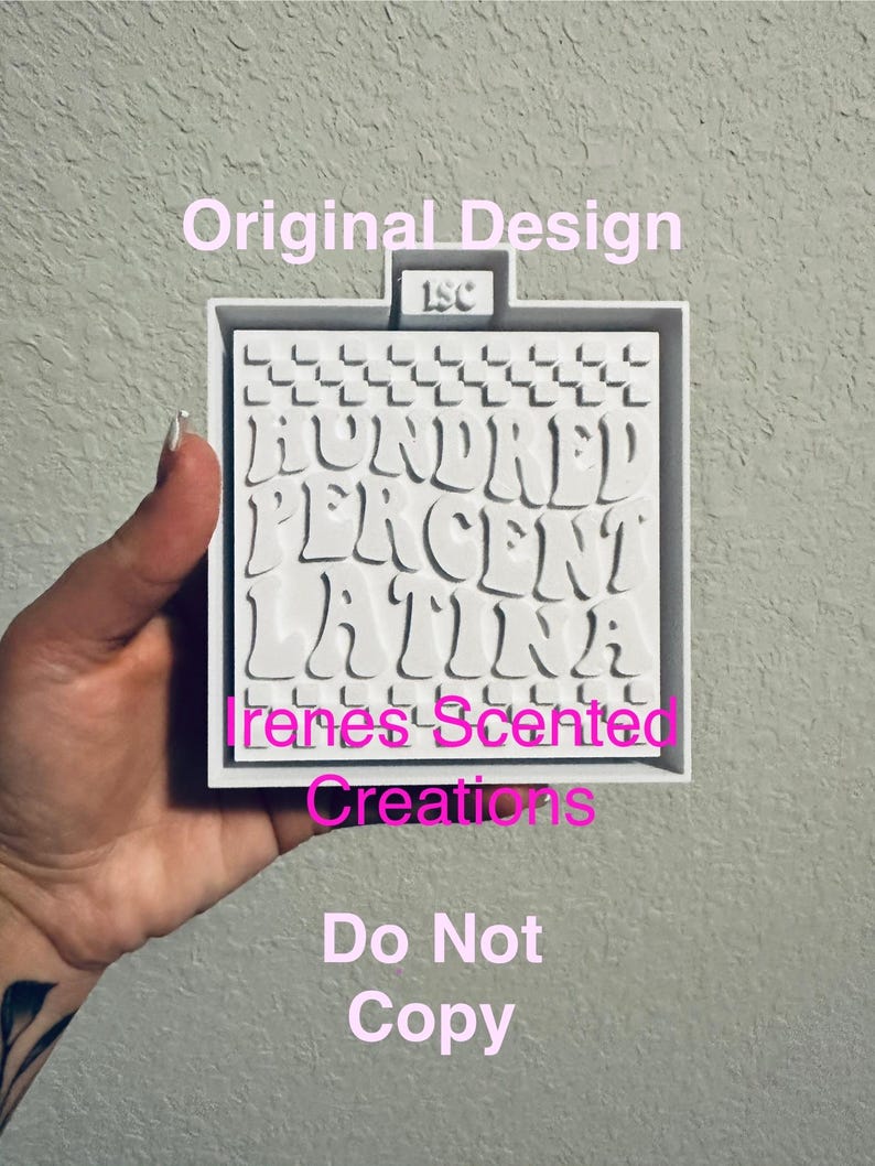 May include: White silicone mold with a checkered pattern and the text "HUNDRED PERCENT LATINA" in a pink, wavy font. The mold also includes the text "Irenes Scented Creations" and "Do Not Copy".