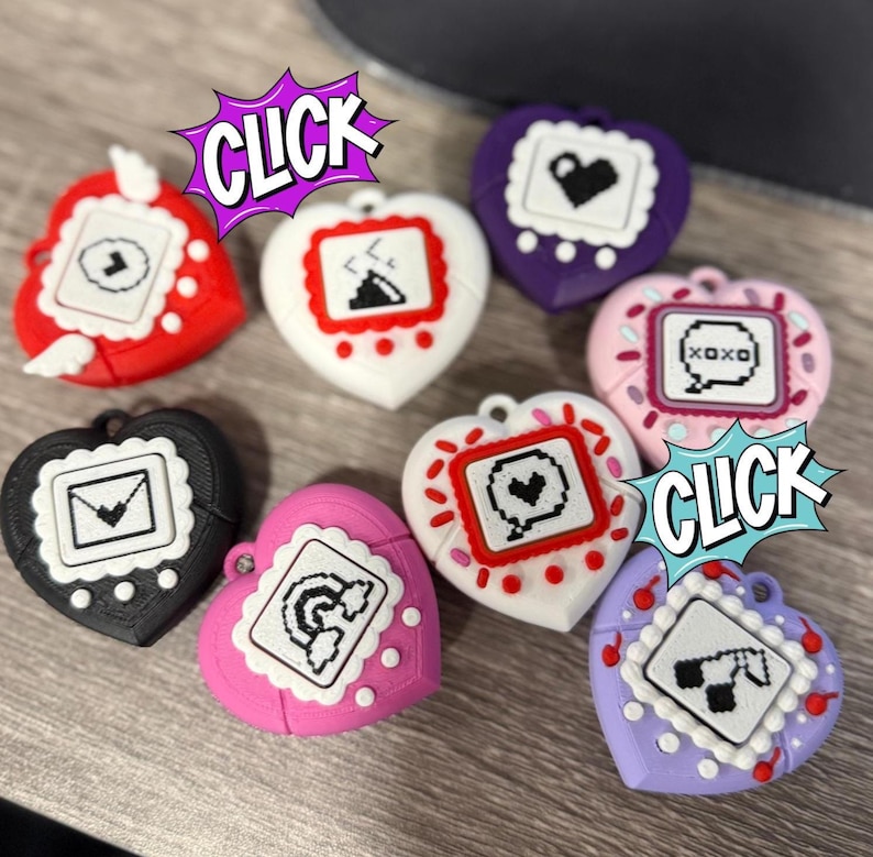 May include: A collection of heart-shaped AirPod cases in various colors, including red, black, white, pink, purple, and lavender. Each case features a unique pixelated design within a square frame. The word "CLICK" appears in a comic book style speech bubble.