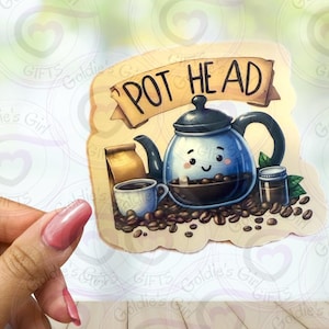 May include: A brown and white sticker with a cartoon illustration of a coffee pot with a face and the text "Pot Head".