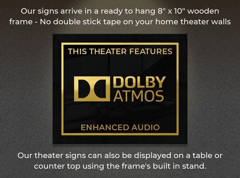 May include: A black framed sign with gold lettering that reads "This Theater Features Dolby Atmos Enhanced Audio". The sign is 8 inches by 10 inches and is ready to hang.