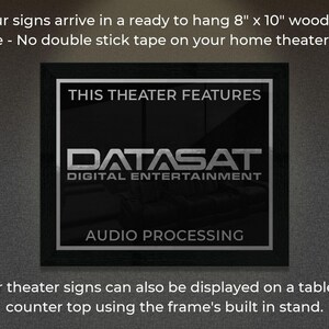May include: A black wooden framed sign with the text "THIS THEATER FEATURES DATASAT DIGITAL ENTERTAINMENT AUDIO PROCESSING". The sign is 8" x 10" and ready to hang.