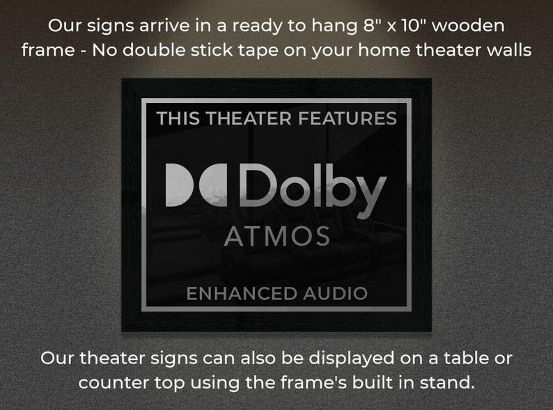 May include: A black framed sign with the text "This Theater Features Dolby Atmos Enhanced Audio". The sign is 8 inches by 10 inches and is ready to hang on a wall.