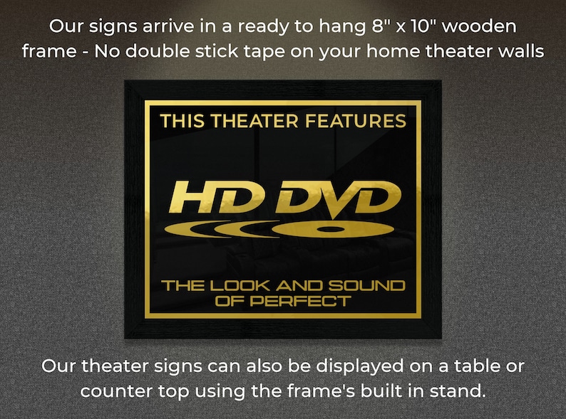 May include: A black framed sign with gold lettering that reads "This Theater Features HD DVD The Look and Sound of Perfect". The sign is 8 inches by 10 inches and is ready to hang on a wall.