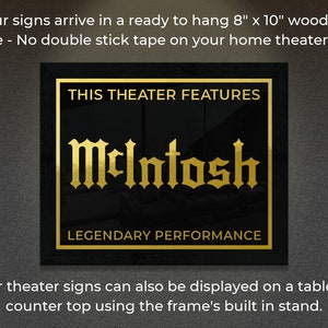 May include: A black framed sign with gold lettering that reads "This Theater Features McIntosh Legendary Performance". The sign is 8 inches by 10 inches and is ready to hang on a wall.
